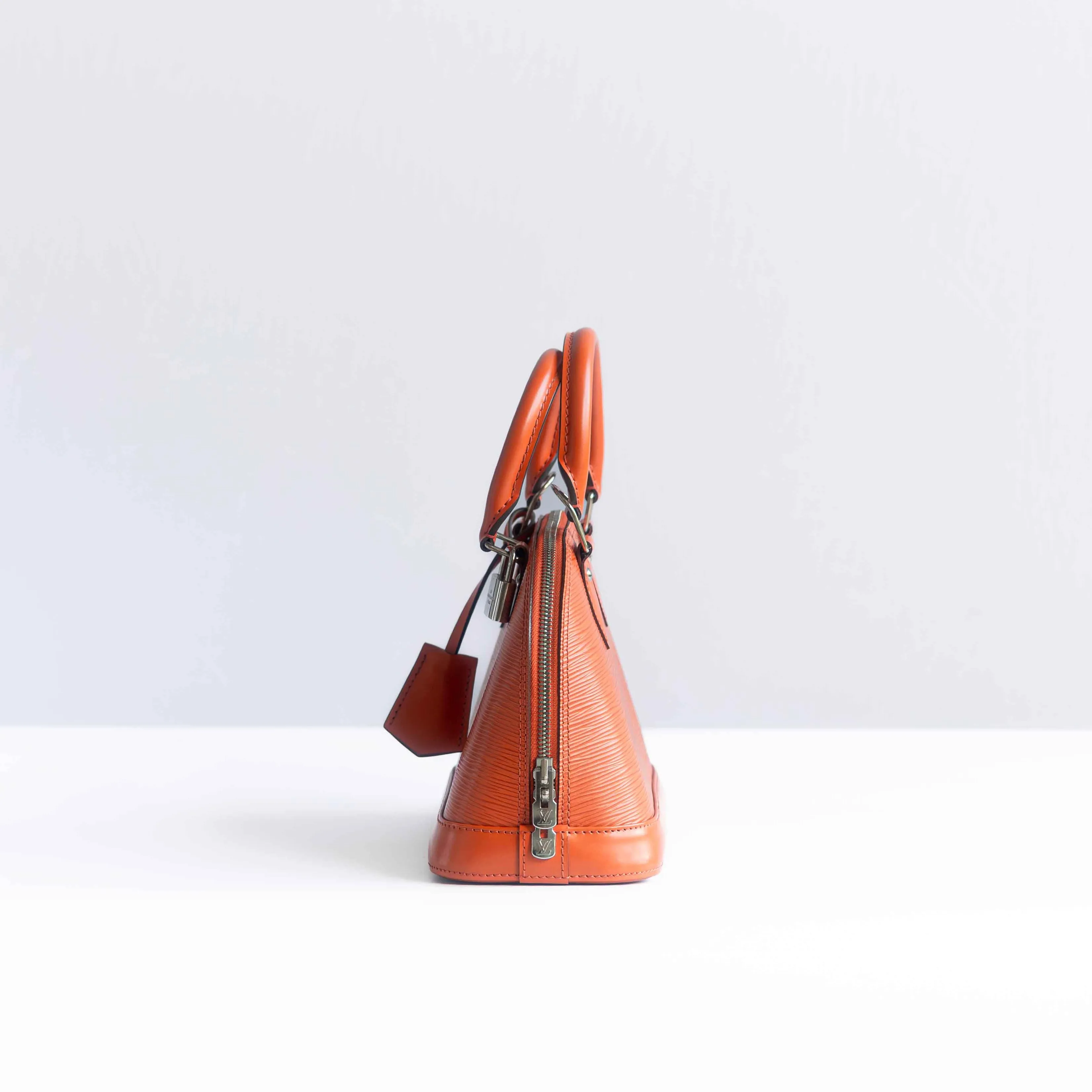 LOUIS VUITTON - BAG ALMA BB ORANGE LEATHER WITH STRAP